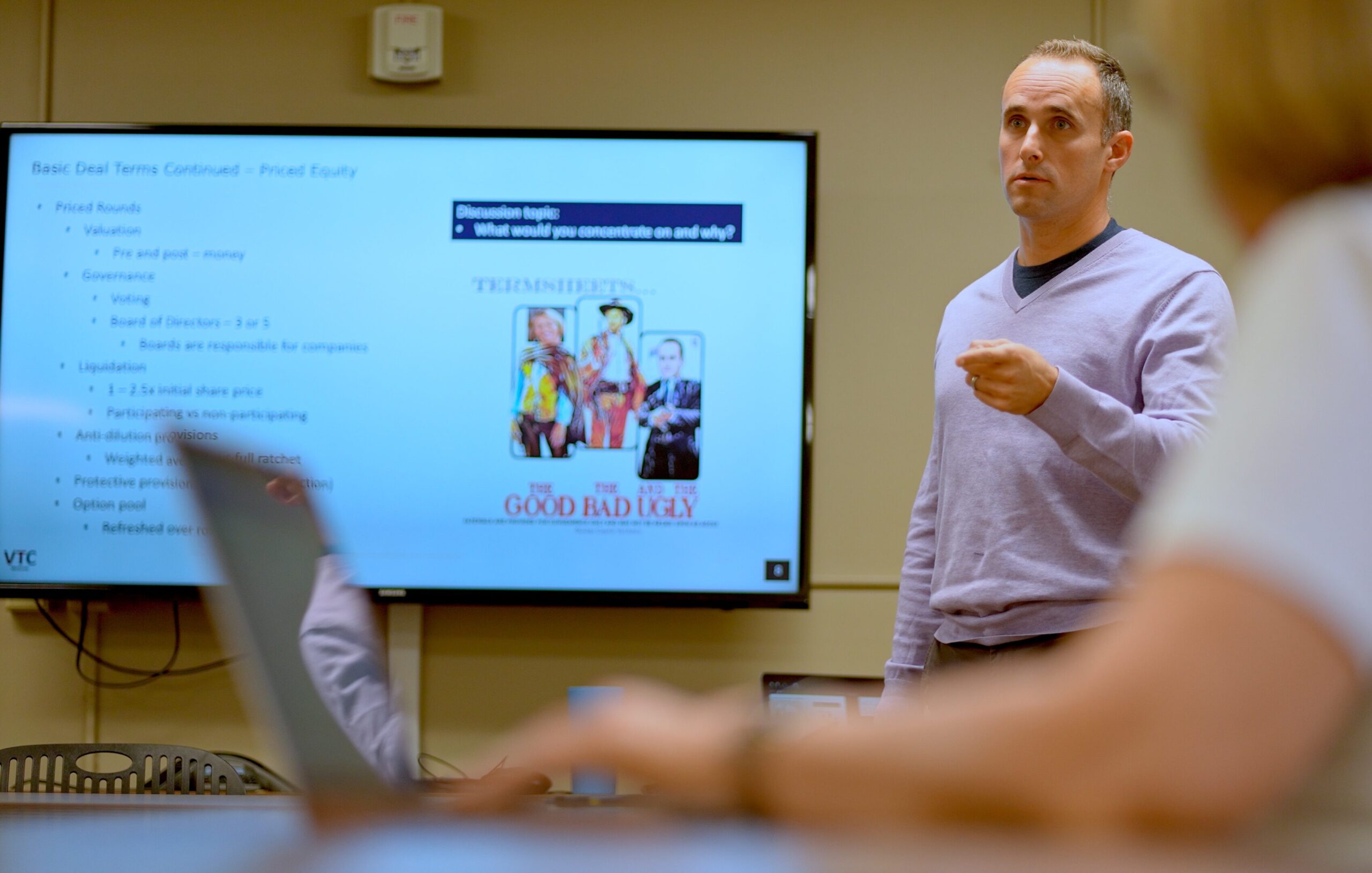 A man giving a presentation to a classroom