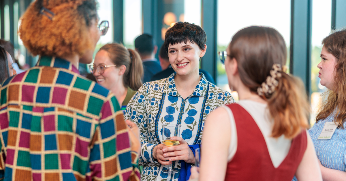 Group of entrepreneurs talking in a social setting